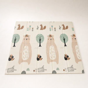 Tapis d'éveil bébé pliable et réversible forêt et lion, vu en entier sur fond clair